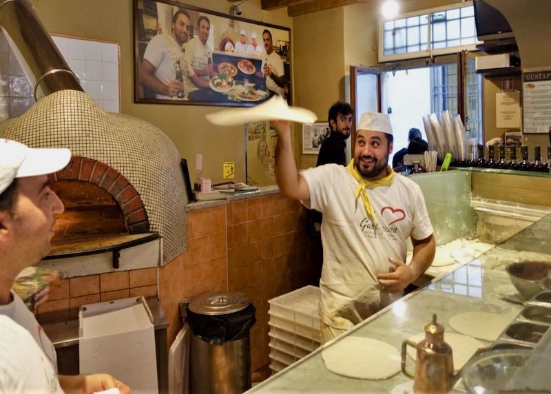 Tossing dough at Gustapizza in Florence, Italy