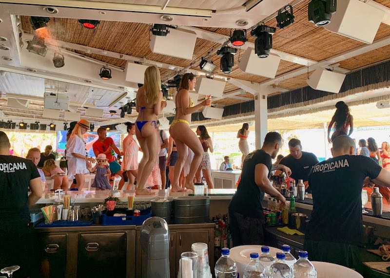 women dancing on bar top