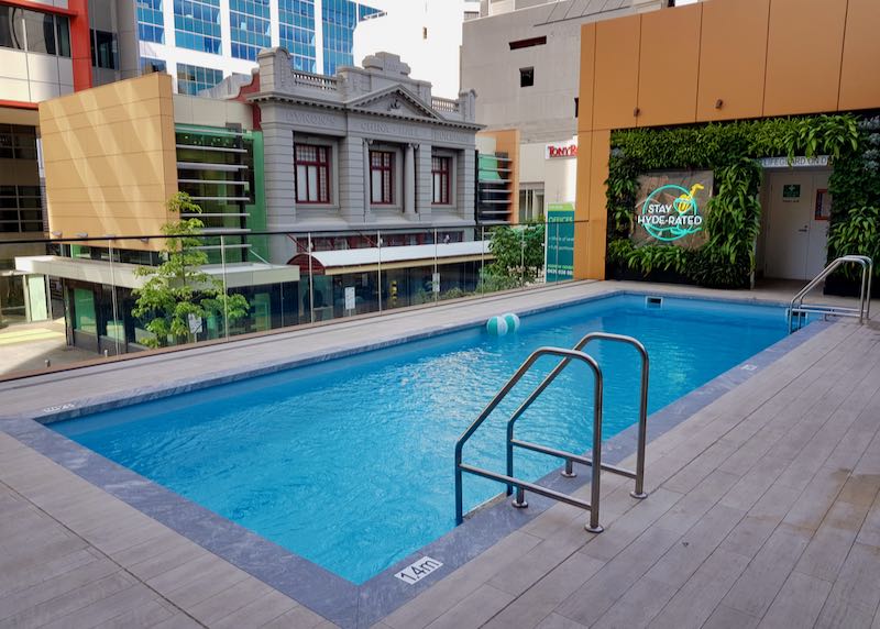 The hotel has a street-facing pool.
