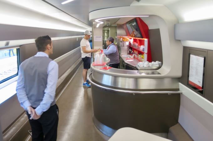 Buying food and tickets onboard an Italy train.