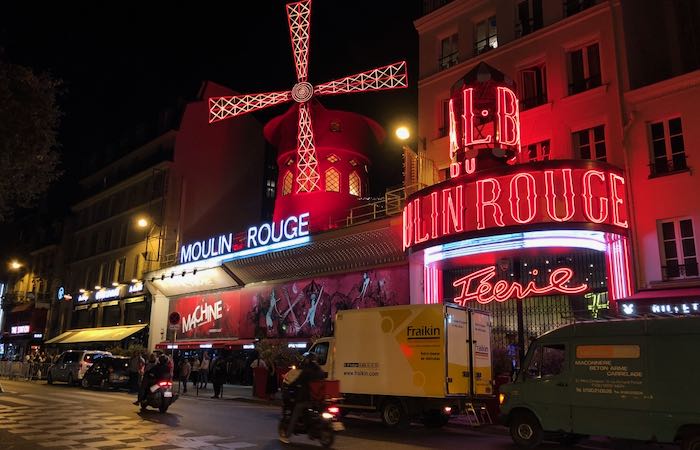 Exterior of the Moulin Rouge nightclub in Paris at night