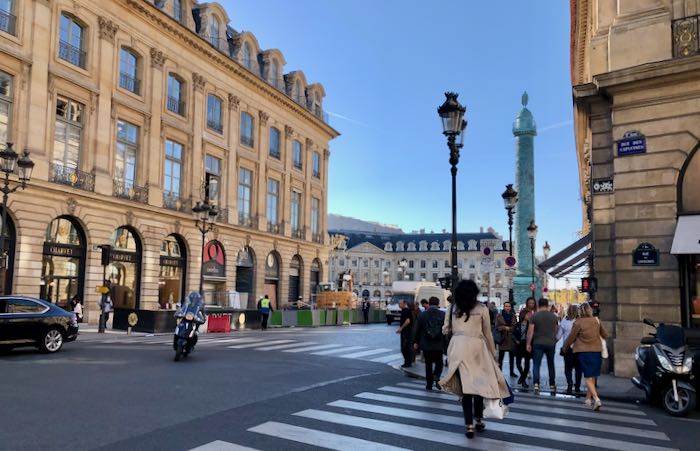 Pedestrians walking through the streets of Paris