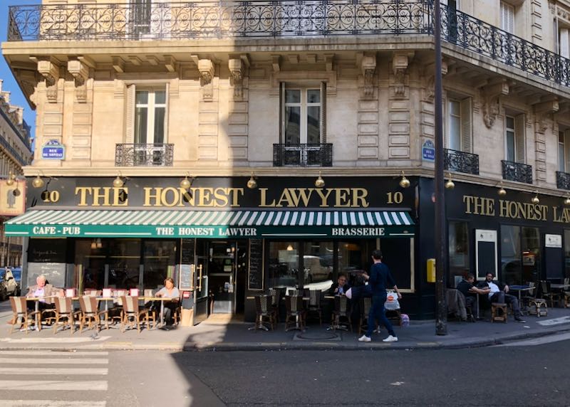 Exterior of the Paris bar, The Honest Lawyer, with patrons in front