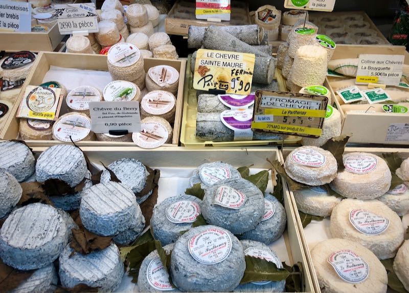 Display of cheeses for sale in a French market