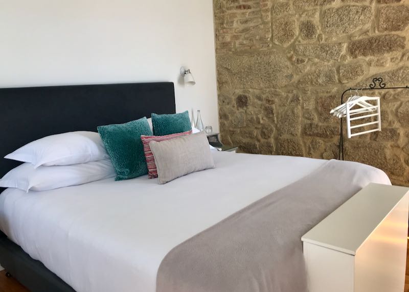 Rooms feature stone walls and comfortable beds.