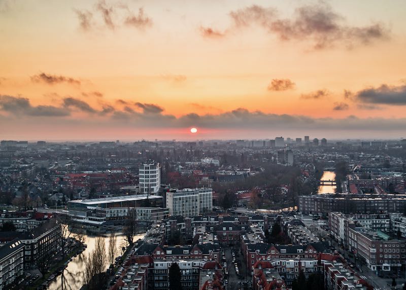 View over the canals and buildings of Amsterdam at sunset