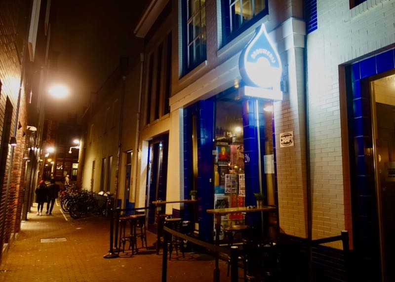 Amsterdam bar on a narrow lane at night