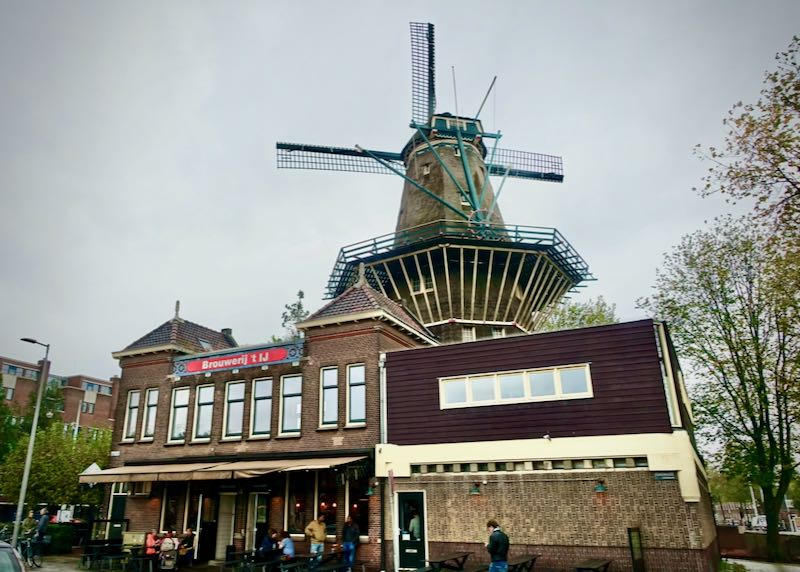 Brewery building beneath a stone windmill