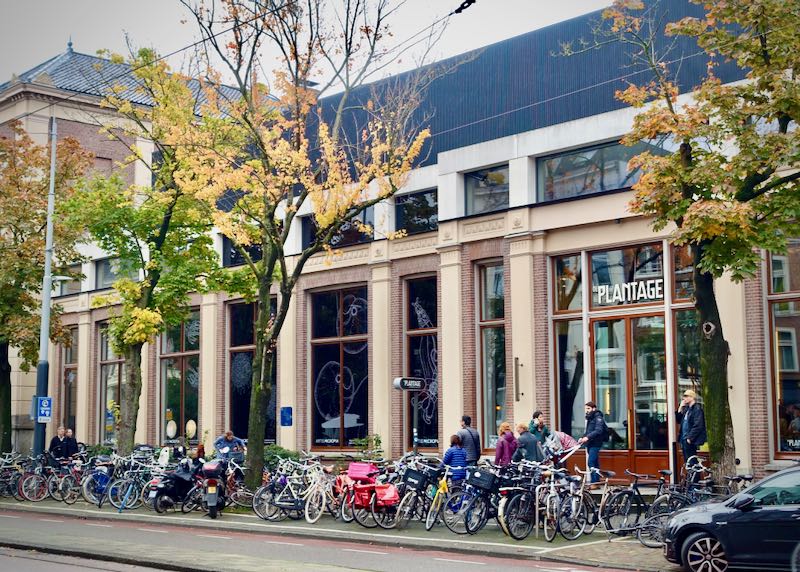 Exterior of an Amsterdam restaurant with bikes out in front