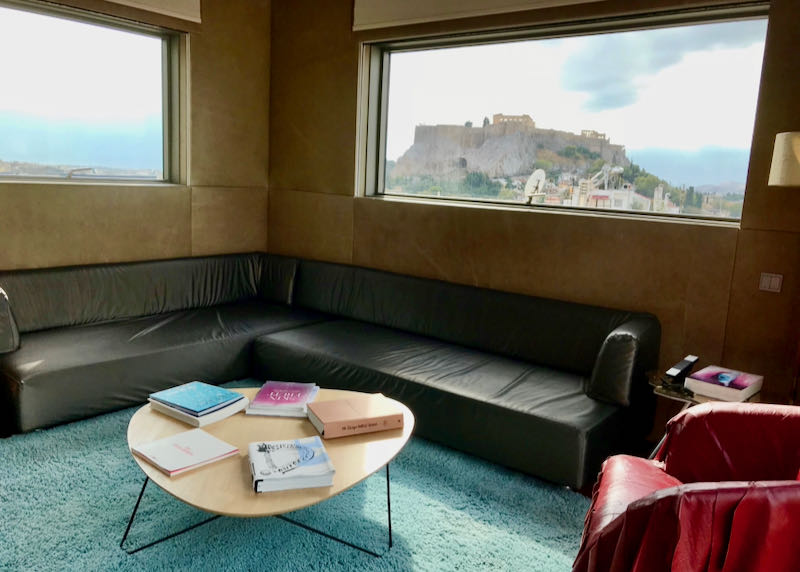 Living room in a hotel suite with a view to the Acropolis.