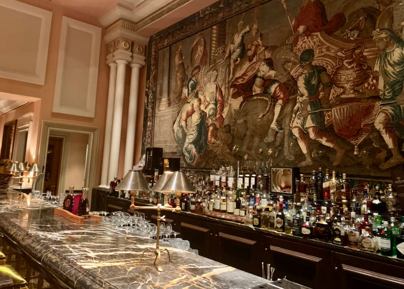 Marble bar, with ornate tapestry hanging above.