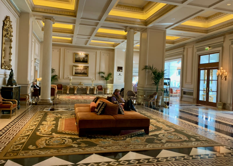 Hotel lobby with marble floors and plush furniture