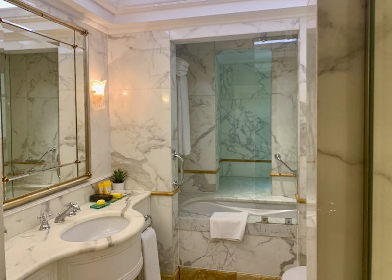 Marble-clad hotel bathroom