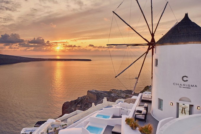 Charisma Suites in Oia with windmill and sunset
