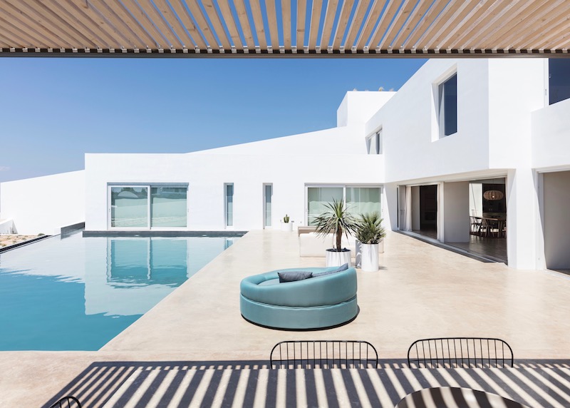 Side view of the main pool terrace of Eden Villa at Andronis Arcadia