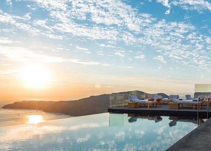 Sunset from the infinity pool at West East Suites in Imerovigli