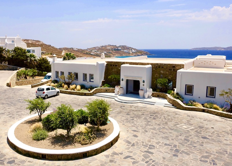Parking lot view of Mykonos Grand in Agios Ioannis