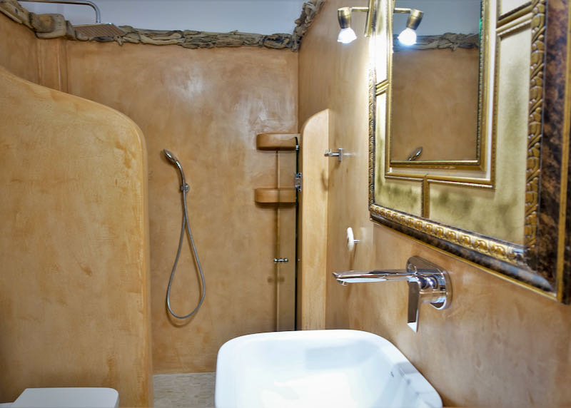 Cave-style bathroom with walk-in shower