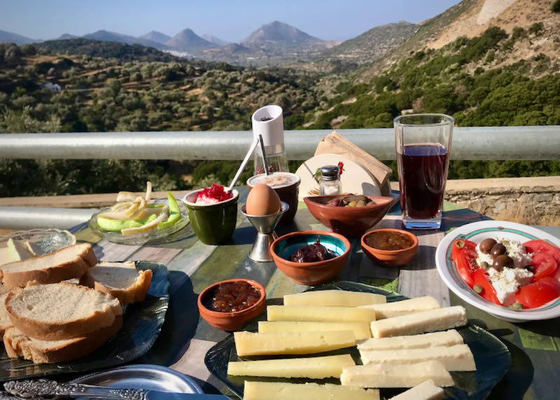 Cheese and wine in front of a mountain view