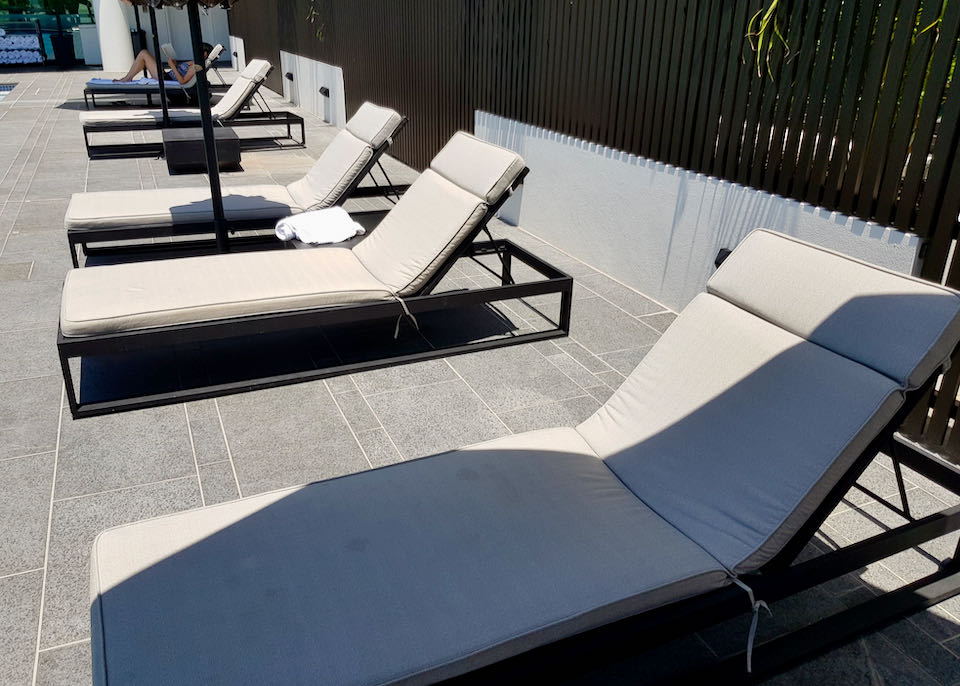 The deck has several lounge chairs.