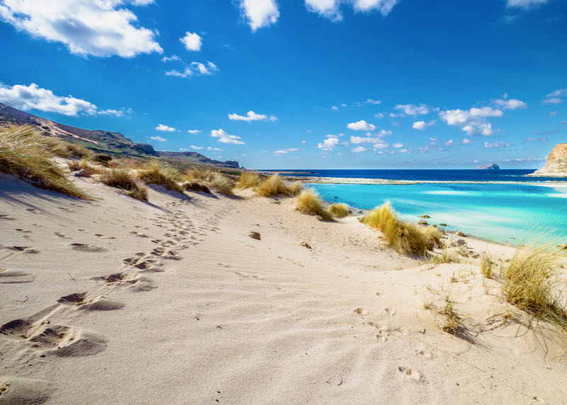 Driving to best beaches with rental car in Crete.