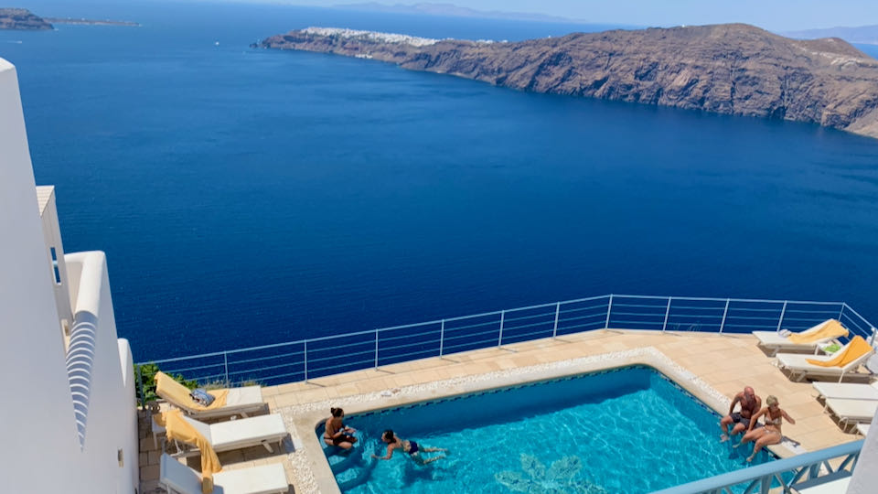 Pool with views of Oia and caldera.