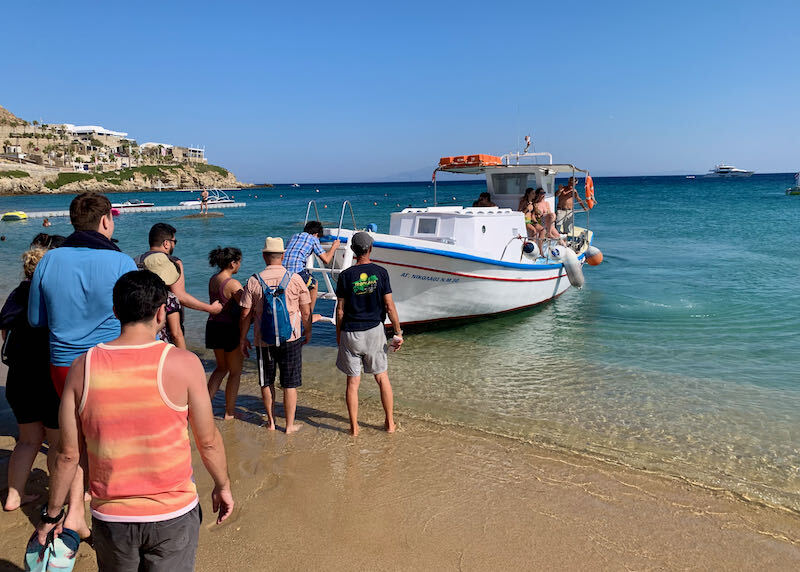 The water taxi to other beach in Mykonos stops right on the beach.