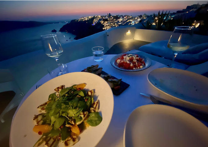Table set for dinner on the cliffs of OIa