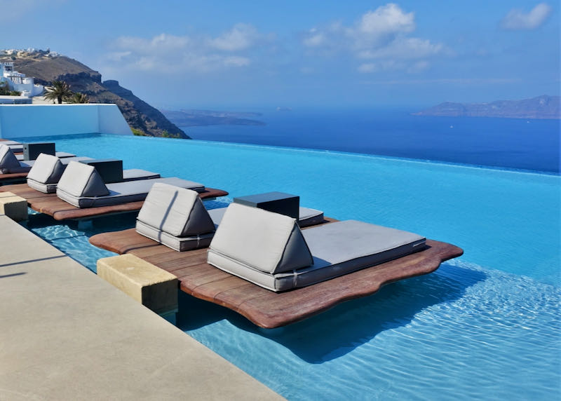 Santorini hotel with pool and caldera view.