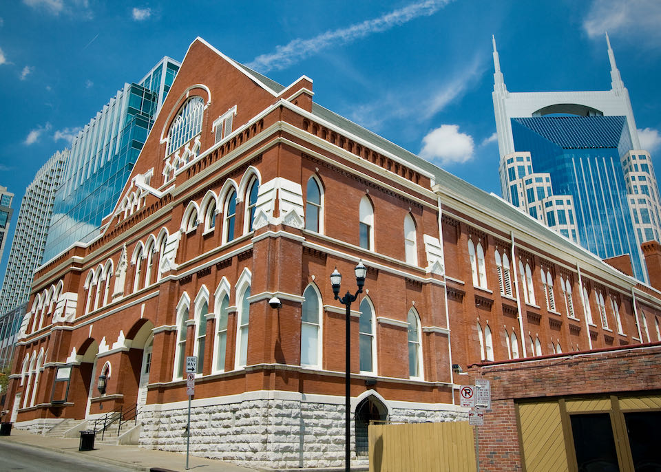 The exterior of Ryman Auditorium in Nashville on a sunny day