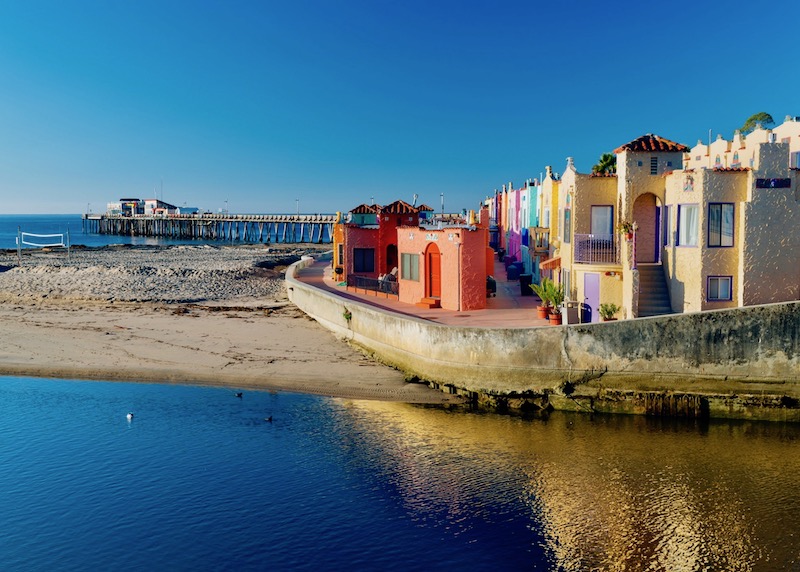 Colorful buildings, the beach, and the wharf in Capitola, California