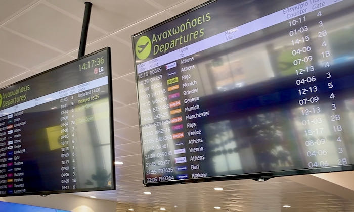 Electronic monitor showing line and gate information for departing flights