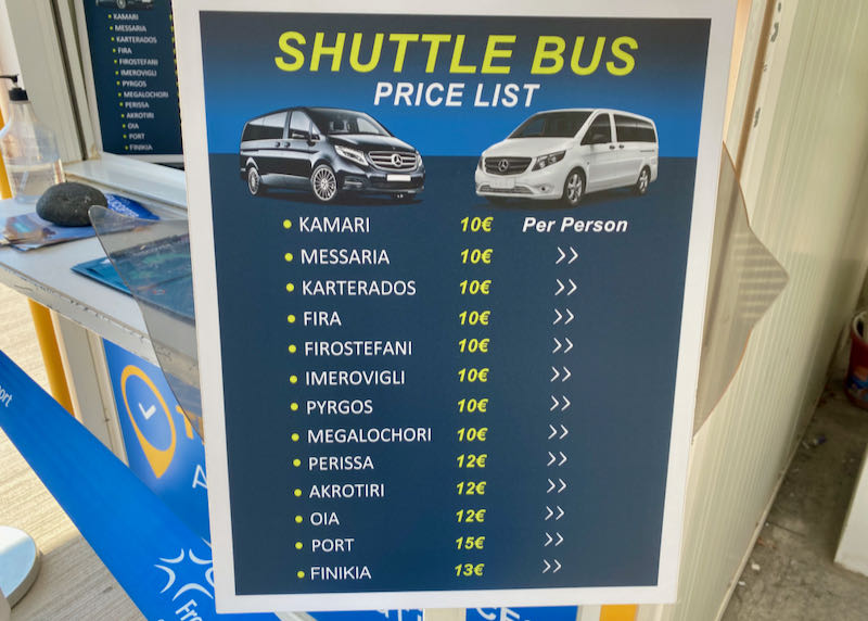 Sign advertising prices for an airport shuttle bus service