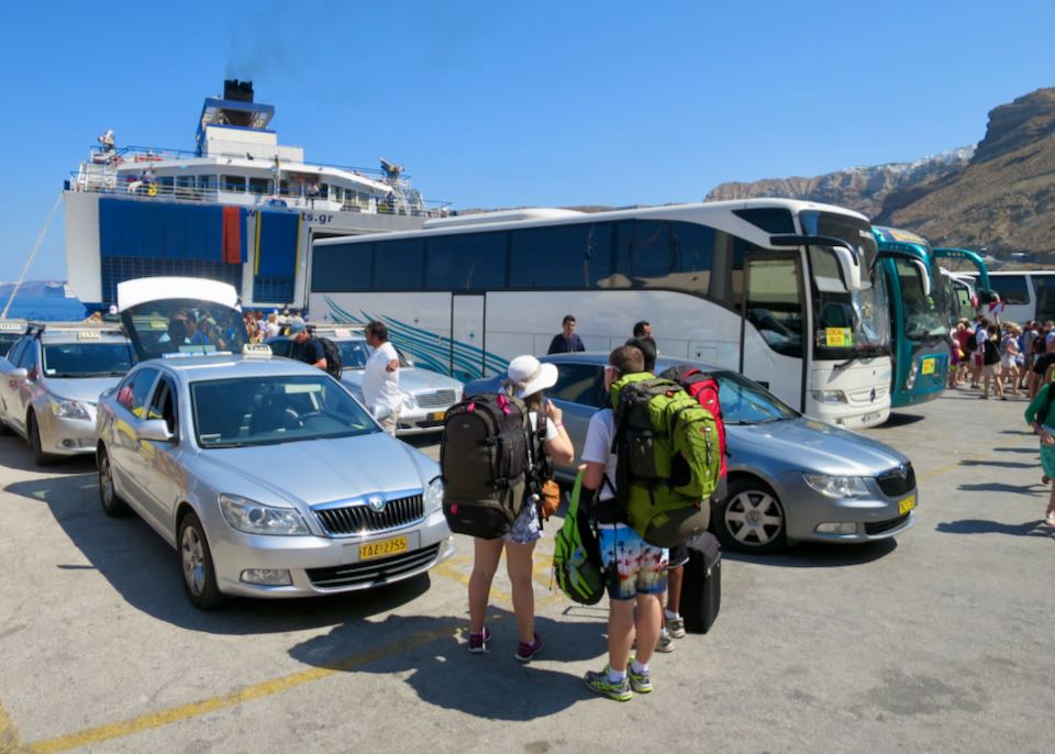 Bus and taxis at the Santorini ferry port.
