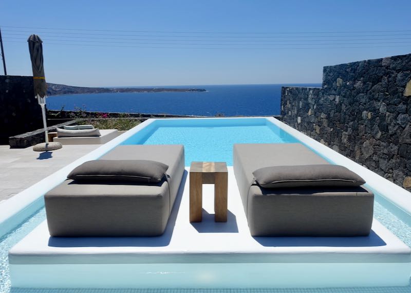 Private pool with water view.
