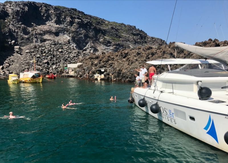 Cruise to Santorini volcano with swimming.