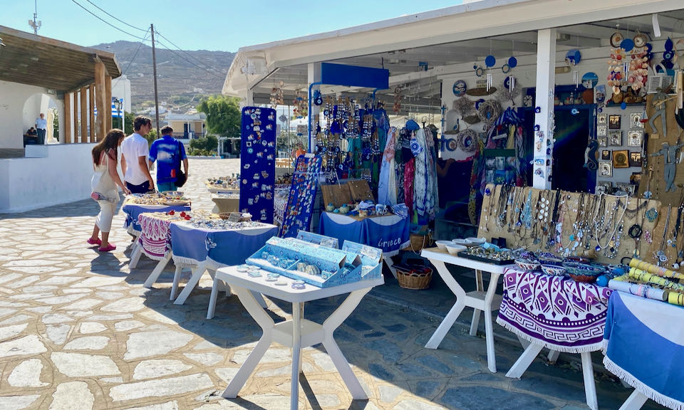 Souvenir shop selling Greek textiles and trinkets.