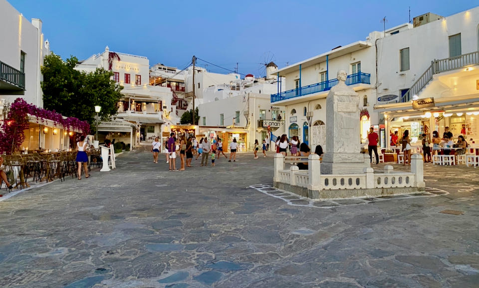 Open plaza of a Greek village, paved in flagstone