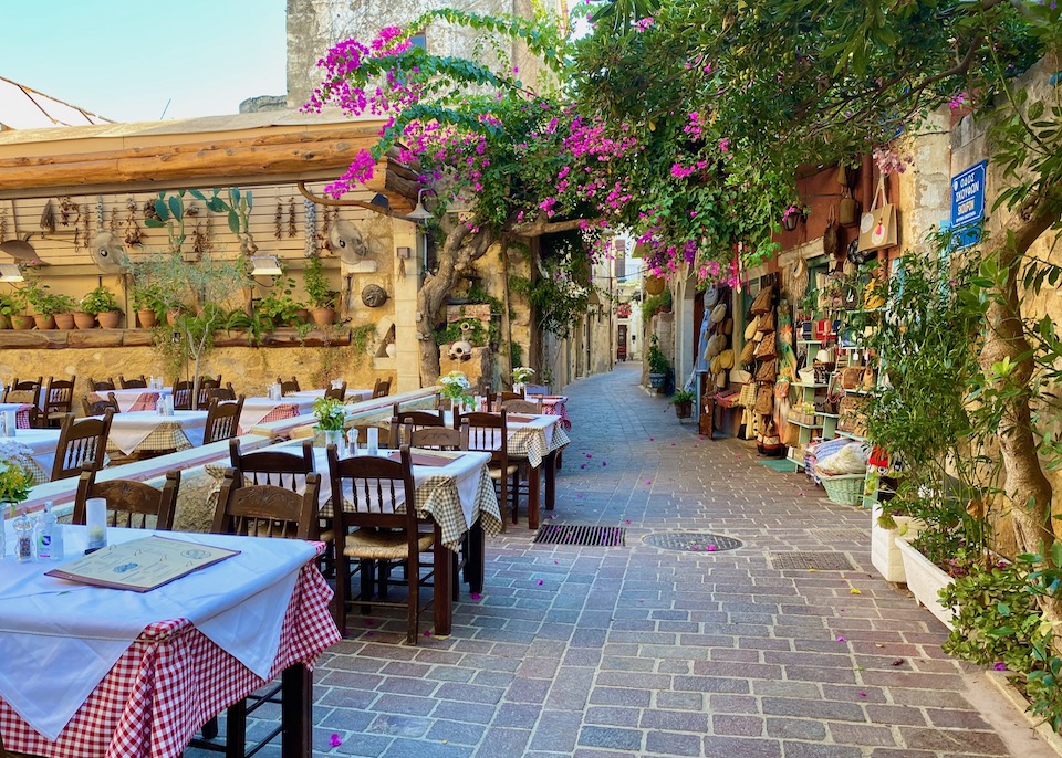 Restaurants, shops, and bougainvilleas in Chania, Crete