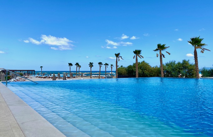 Pool and beach view at Nana Princess Resort in Hersonissos, Crete