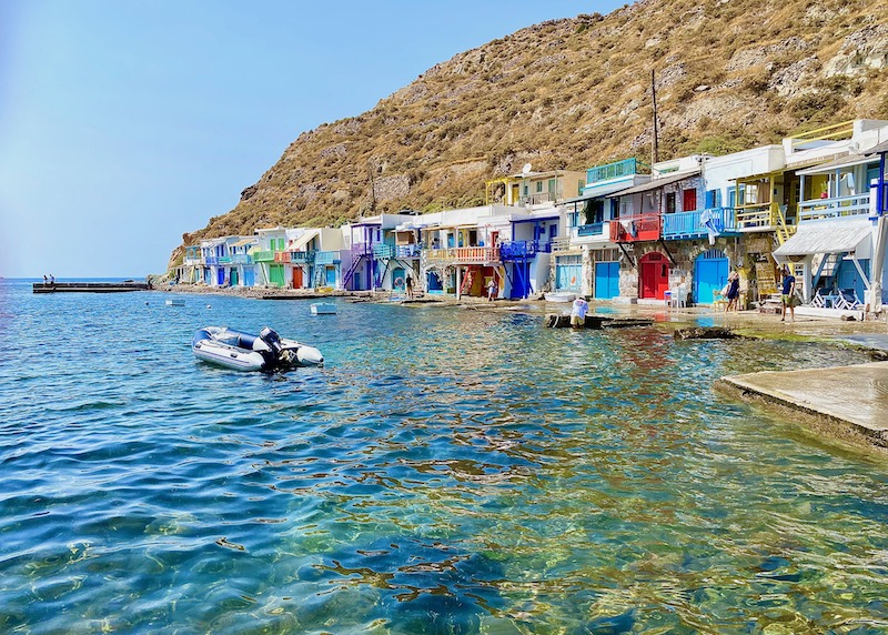 Klima fishing village with colorful syrmata on the sea.