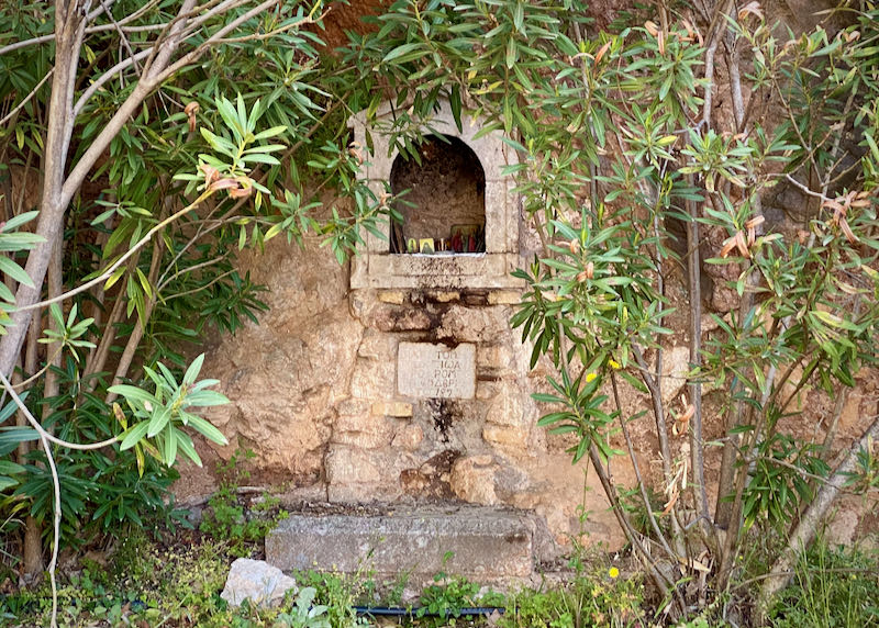 Stone niche with Greek icons inside