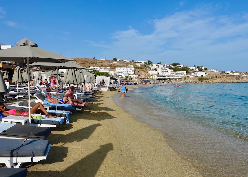 Sunbeds and umbrellas at Acrogiali Hotel on Platis Gialos Beach in Mykonos