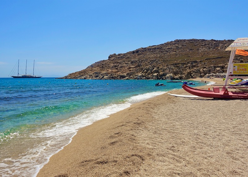 View of Agrari Beach in Mykonos with Sunrise Hotel in the distance.