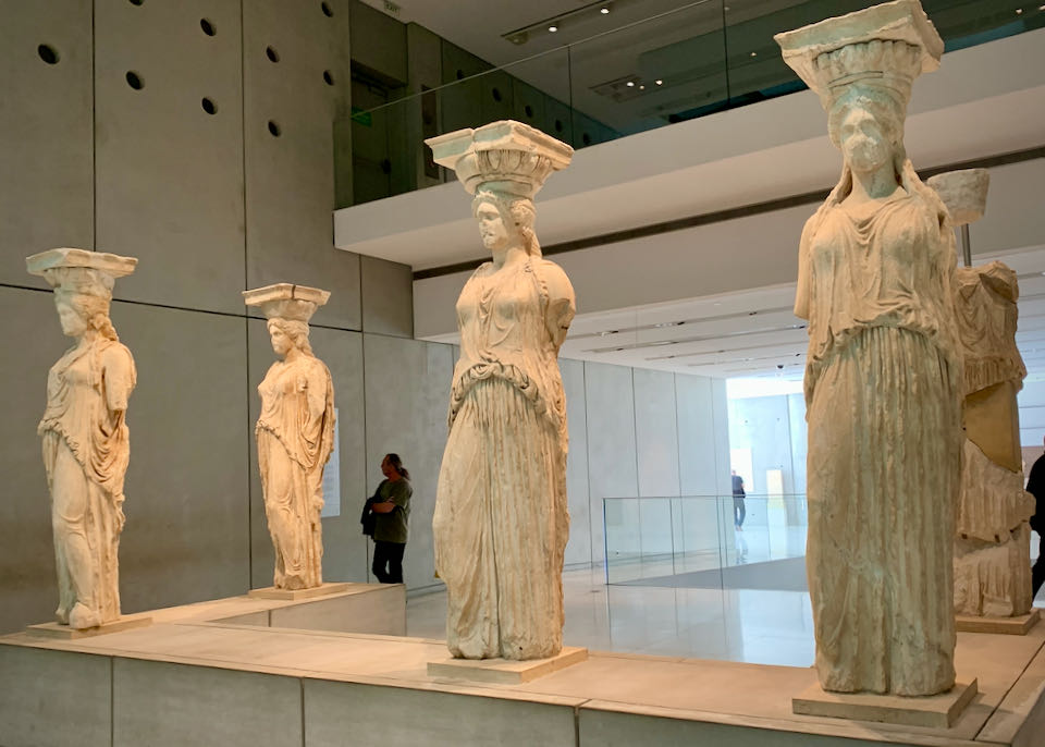 Marble caryatid sculptures on display in a museum