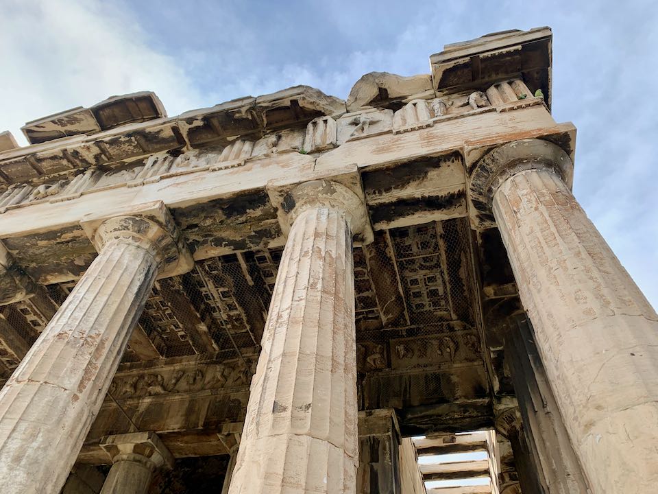 View looking up at the pillars and roof of the Temple of Hephaestus in Athens