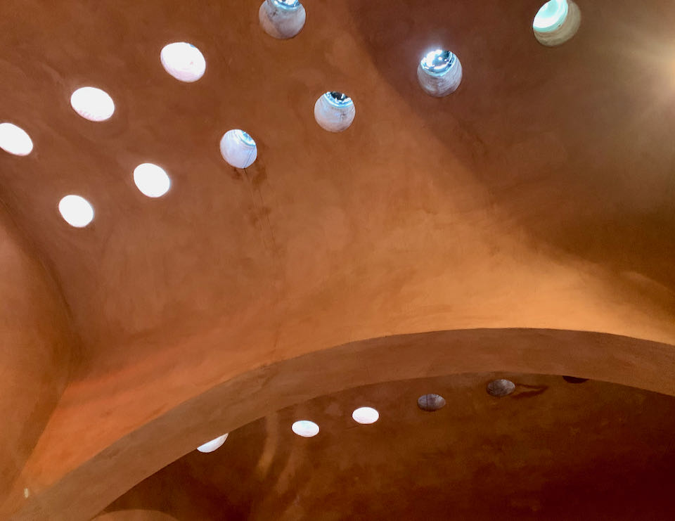 Terra cotta ceiling with circular glass skylights