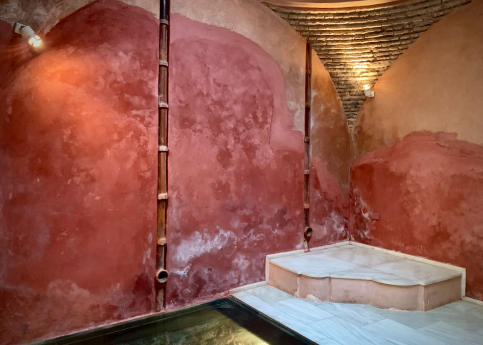 Room with marble tile floor and rustic terra cotta walls