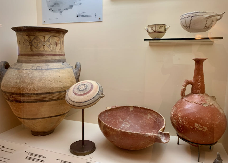 Deecorated clay vessels in a museum display
