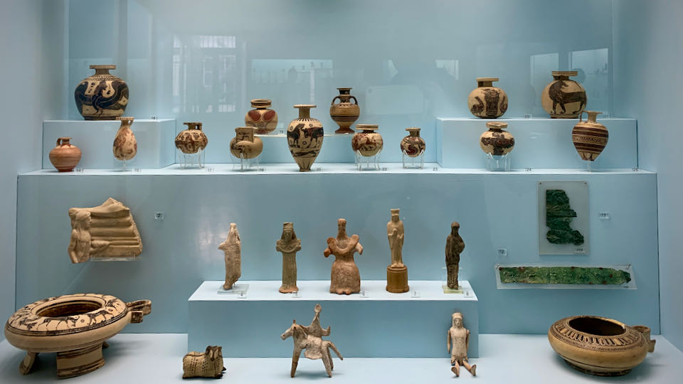 Clay human figurines in a museum display